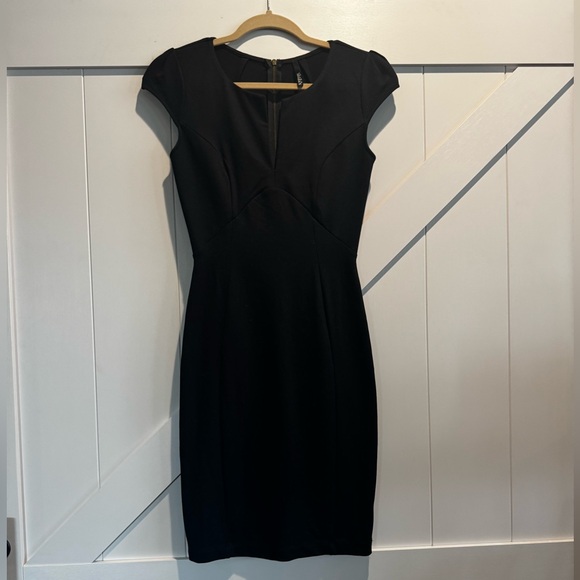 Dresses & Skirts - Black Dress with low cut front slit